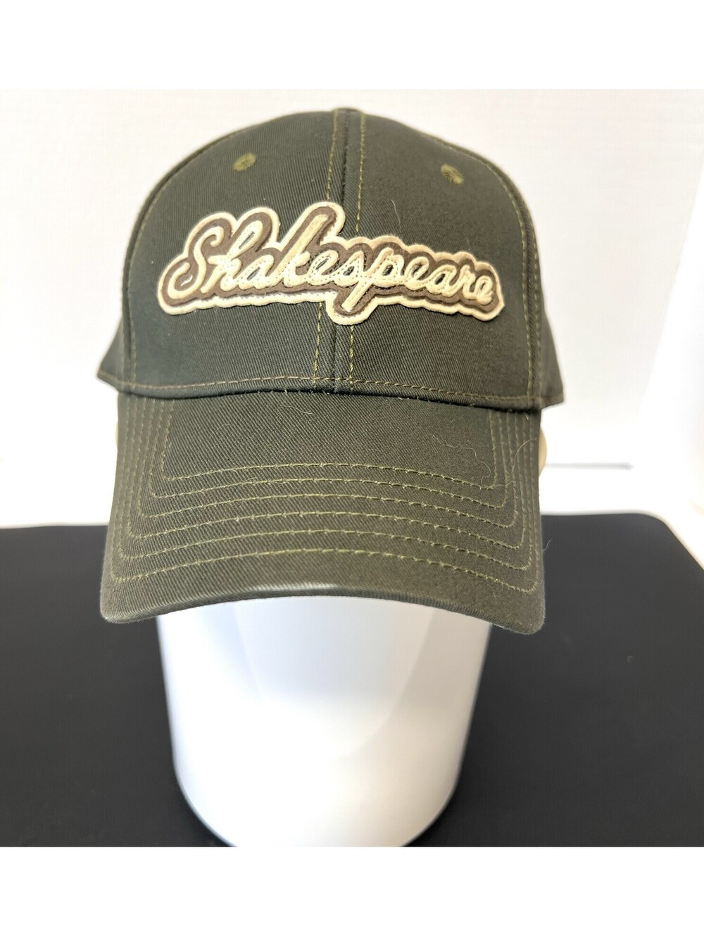 Shakespeare Fishing Strap Back Green Tan Embroidered Trucker Hat Baseball Cap